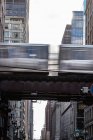 Elevated train driving along train tracks, Chicago, Illinois, United States — Stock Photo