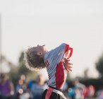 Boy playing flag football celebrating, California, United States — Stock Photo