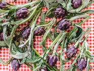 Fresh artichokes on a table, Italy — Stock Photo