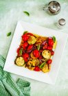 Baked vegetables with potatoes and herbs — Stock Photo