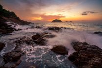 Waves crashing on coastal rocks at sunrise, Redang Island, Terengganu, Malaysia — Stock Photo