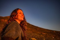 Woman in rocky scene at sunset, Stellenbosch, Western Cape, South Africa — Stock Photo