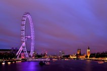 City skyline and London Eye at dusk, London, England, United Kingdom — Stock Photo