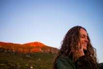 Woman in rocky scene at sunset, Stellenbosch, Western Cape, South Africa — Stock Photo