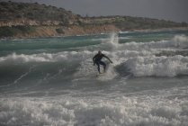 Action shot of Man surfing, Greece — Stock Photo