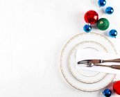 Place setting with Christmas baubles — Stock Photo