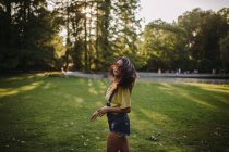 Portrait of a woman standing in the park tossing her hair, Serbia — Stock Photo