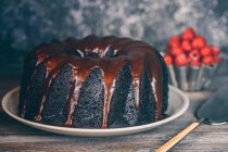 Delicious cake covered with melted chocolate, selective focus — Stock Photo