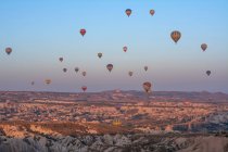Hot air balloons flying over Cappadocia, Goreme, Turkey — Stock Photo