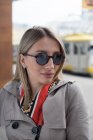 Portrait of a woman standing in the street wearing sunglasses, Bosnia and Herzegovina — Stock Photo