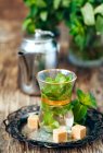 Mint tea with sugar cubes — Stock Photo