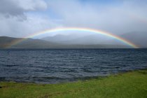 Rainbow over lake, Te Anau, South Island, New Zealand — Stock Photo