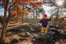 Boy jumping in the air in a forest, Stati Uniti — Foto stock