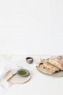 Ciabatta bread, olive oil, salt and a glass of water — Stock Photo