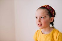 Portrait of emotional little girl on white wall background — Stock Photo