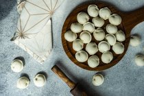 Overhead view of Russian pelmeni dumplings being prepared — Stock Photo