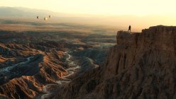Hot air balloons fly during sunset in the Badlands off Font's Point — Stock Photo