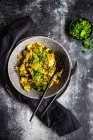 Traditional georgian summer lobio dish with  french beans with eggs and herbs on stone background with copy space — Stock Photo