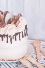 Chocolate buttercream cake decorated with a variety of chocolates — Stock Photo