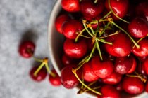 Bowl of fresh red cherries, top view — Stock Photo