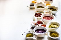 Overhead view of dried chilli, chilli paste, assorted herbs and spices — Stock Photo