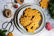 Christmas gingerbread cookies in stone bowl on concrete background — Stock Photo