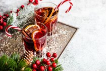 Christmas drink concept with glass of mulled wine with spices around — Stock Photo