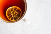 Top view of cup of tea with slice of lemon — Stock Photo