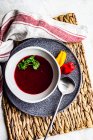 Bowl of creamy beetroot soup with chili and parsley — Stock Photo