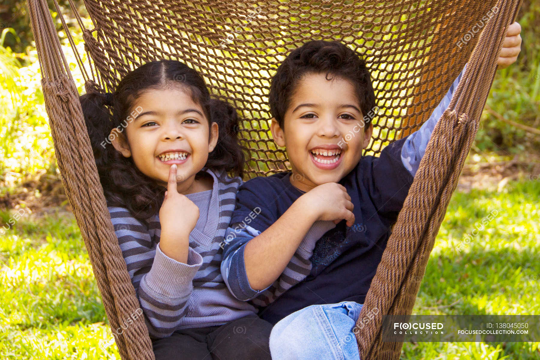 twin-brother-and-sister-hammock-female-stock-photo-138045050