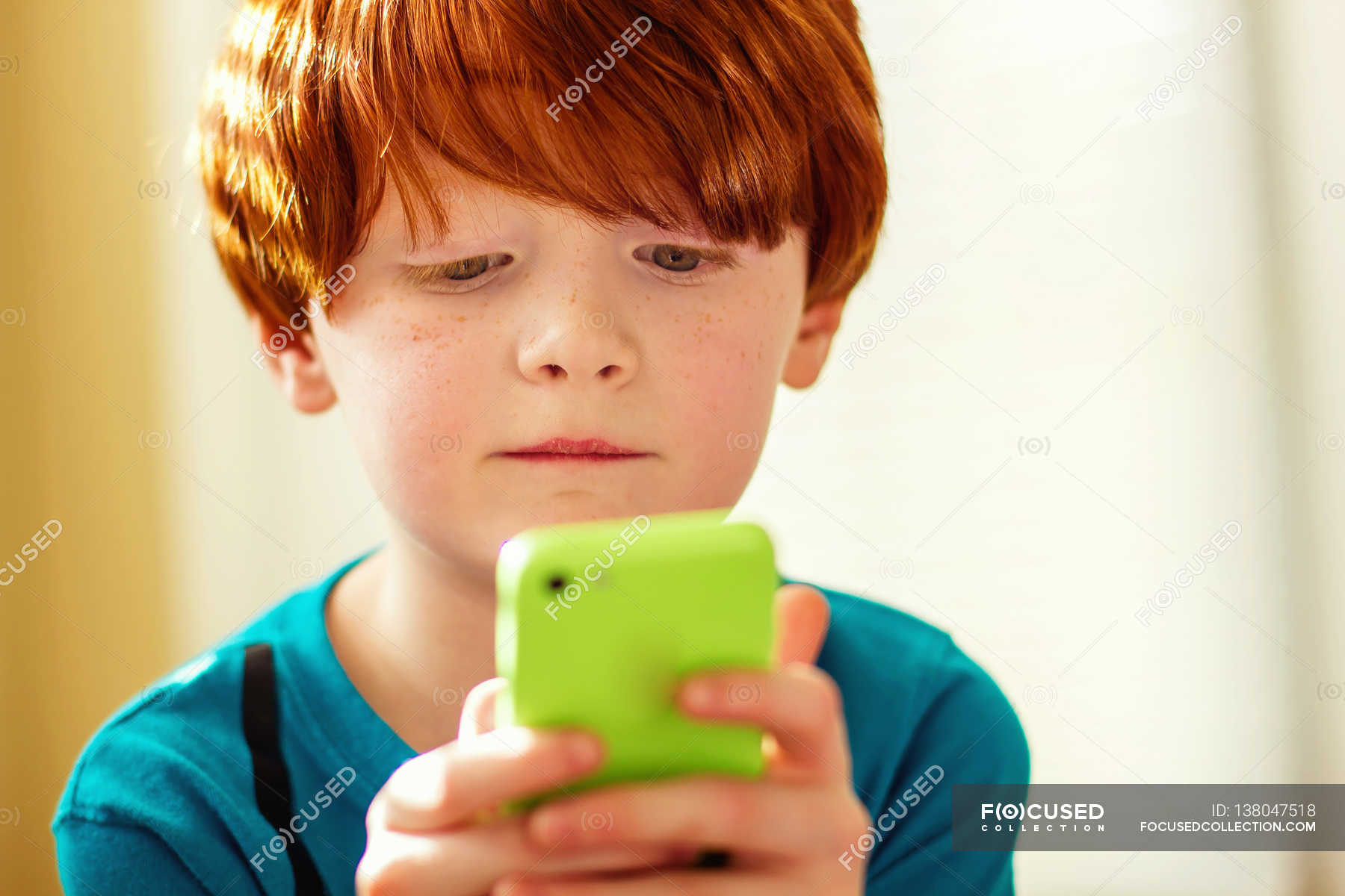 young-boy-playing-mobile-game-technology-wireless-technology-stock-photo-138047518