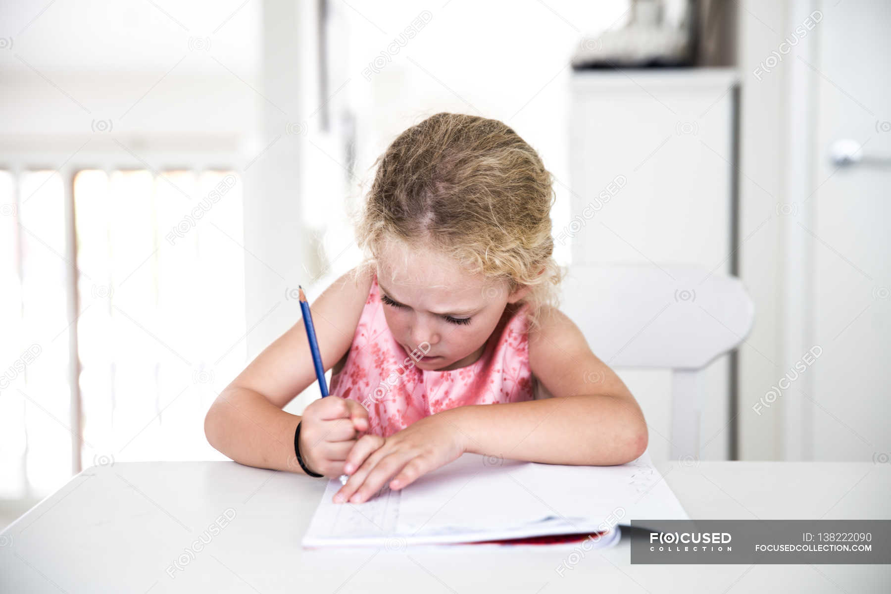 Girl rubbing out homework — dedication, learning Stock Photo 138222090