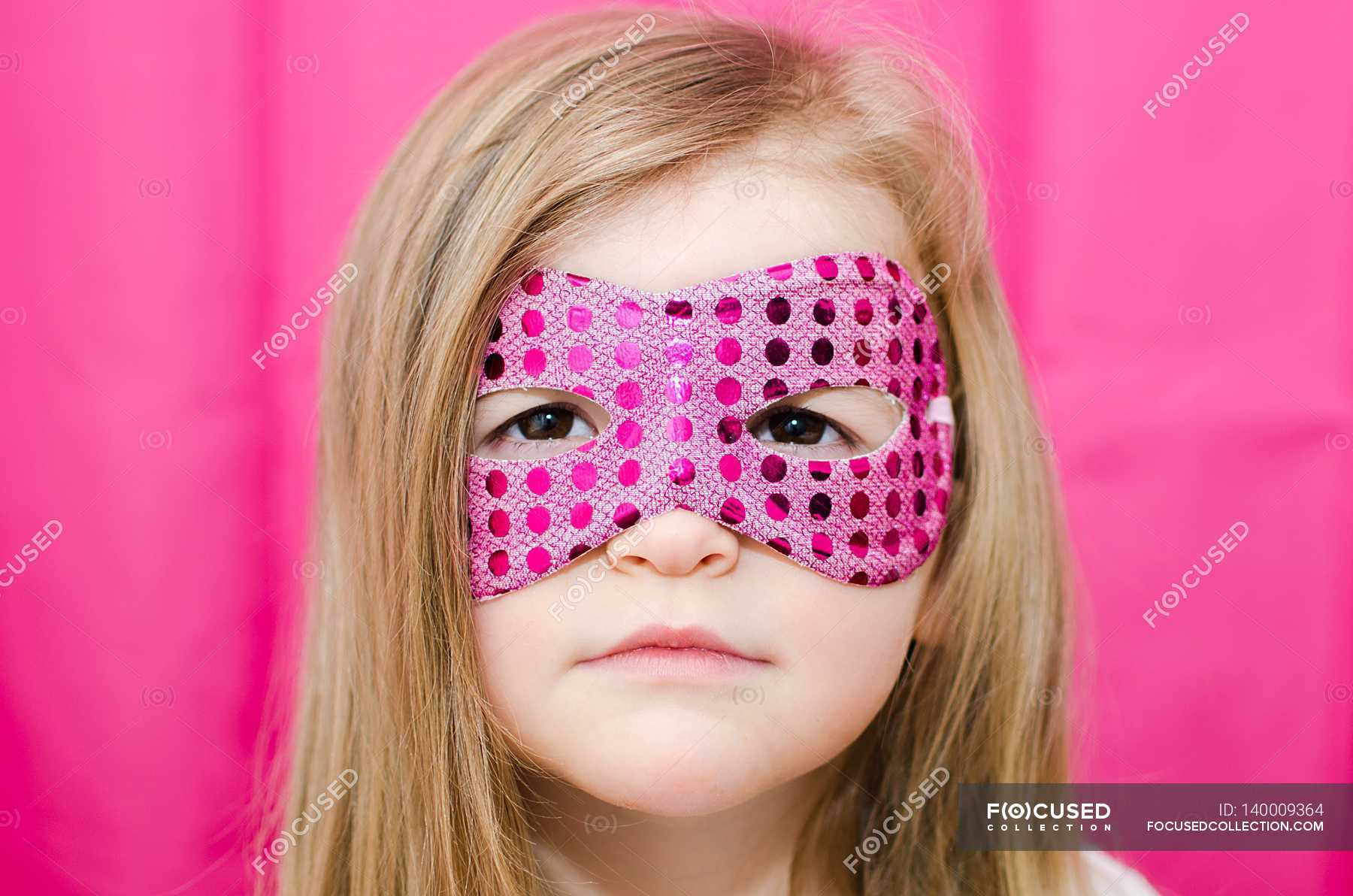 girl-wearing-superhero-mask-horizontal-2-3-years-stock-photo