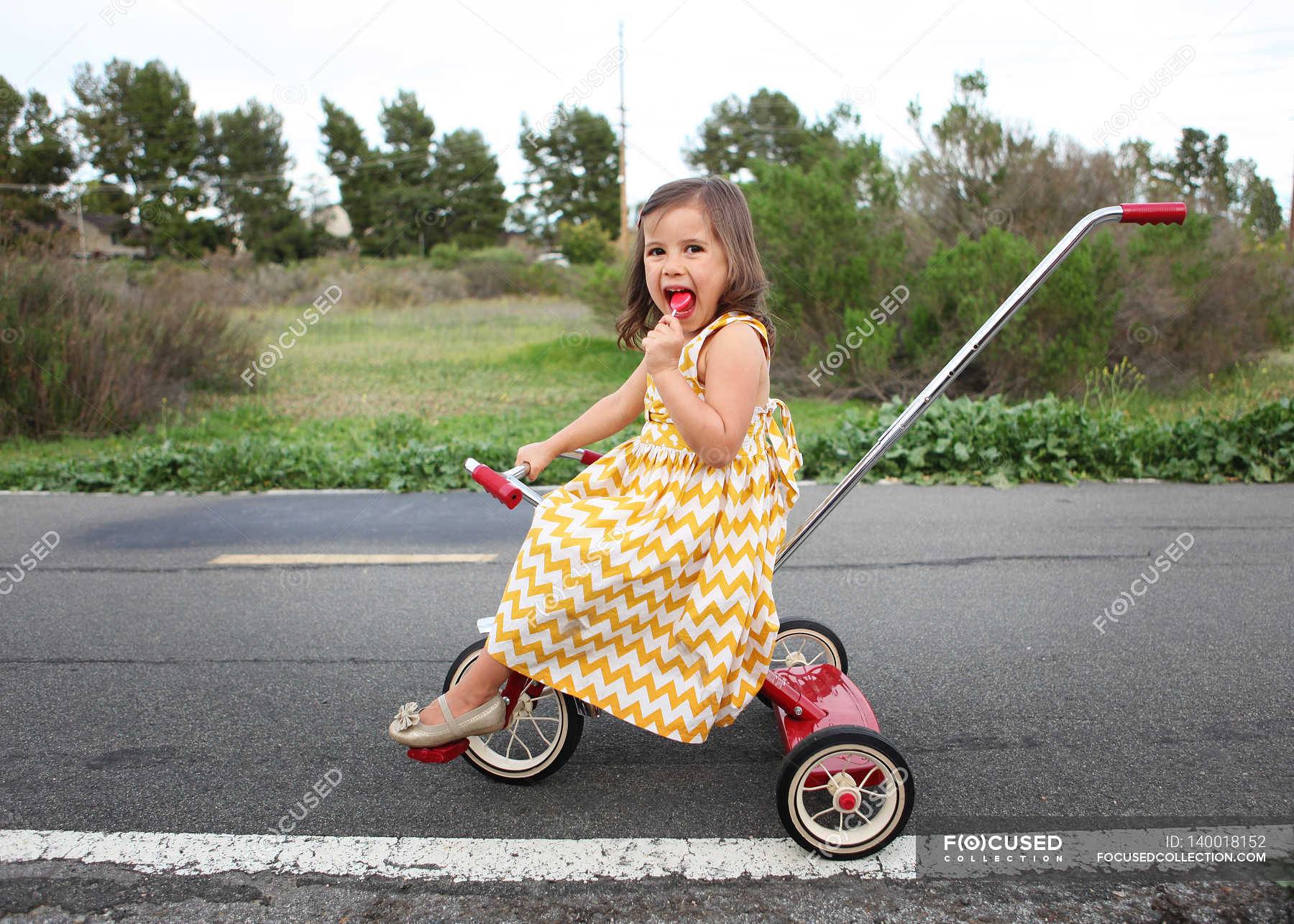girl on tricycle