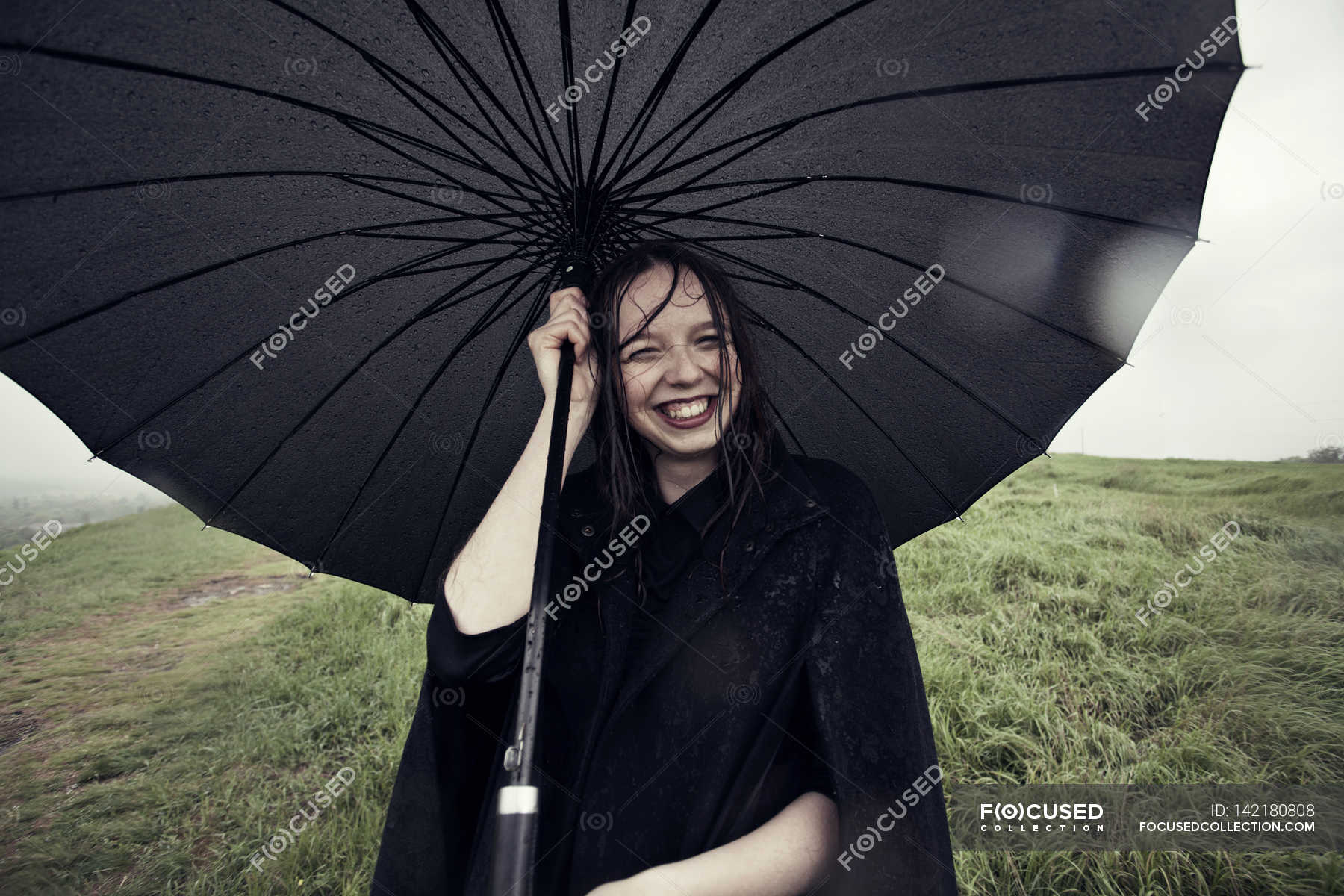 Woman holding umbrella in wind — expression, people - Stock Photo ...