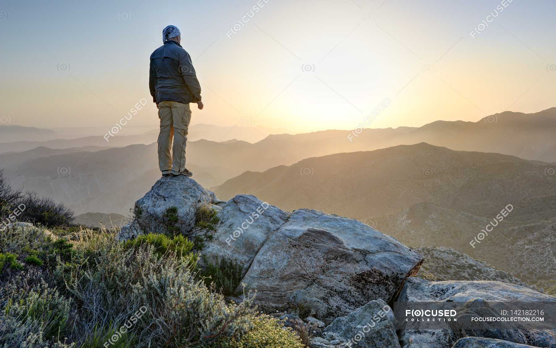 Man Standing On Top Of Mountain — Wide Angle Full Length Stock Photo