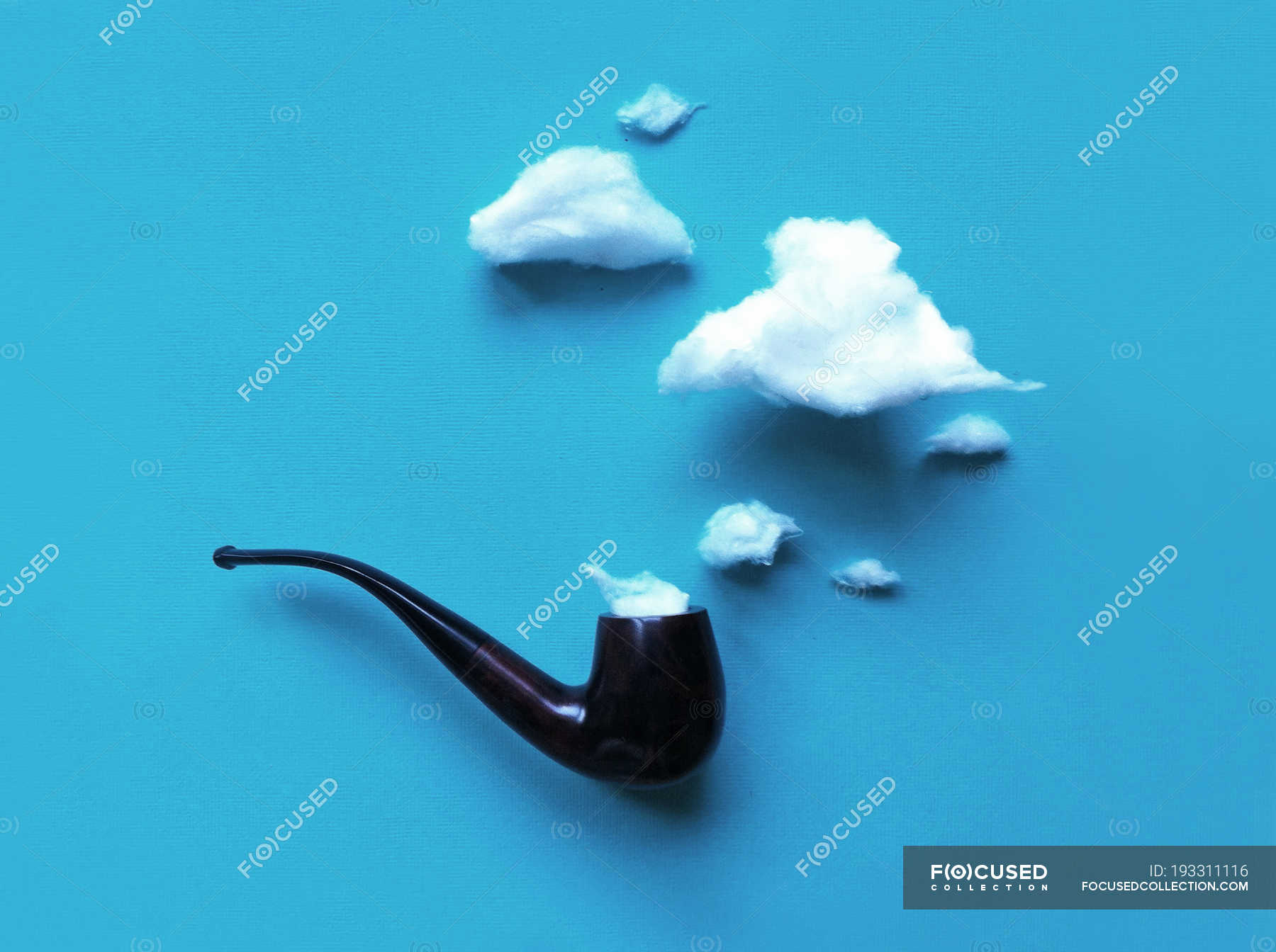 conceptual-smoke-coming-out-of-a-pipe-against-blue-background