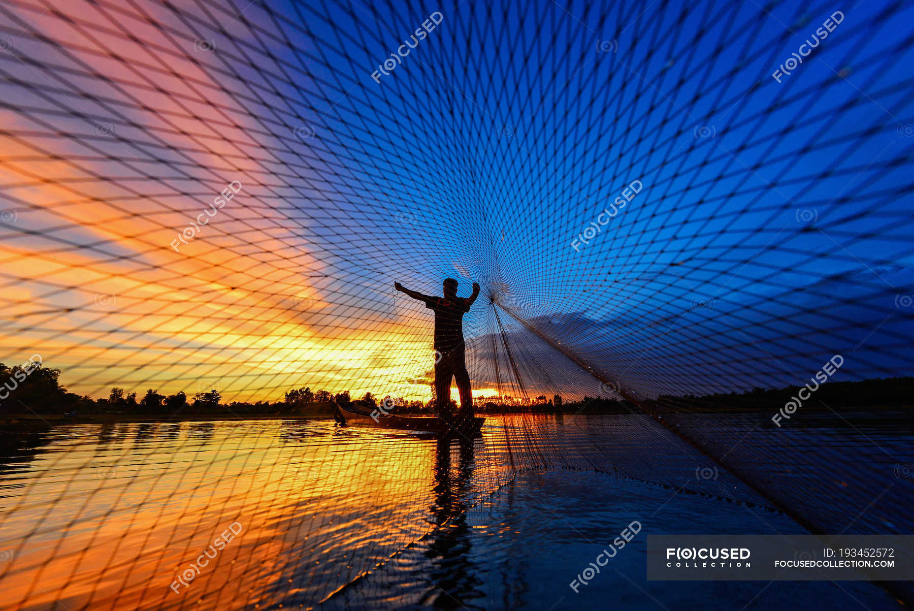 Fisherman Casting Fishing Net At Sunset Thailand Sunlight Throwing Stock Photo 193452572