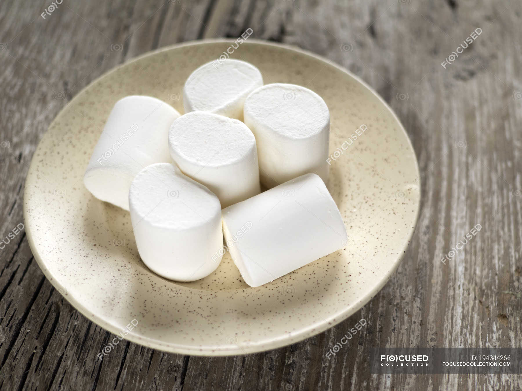 Stack Of Marshmallows On A Plate Over Wooden Background Tasty Food   Focused 194344266 Stock Photo Stack Marshmallows Plate Wooden Background 