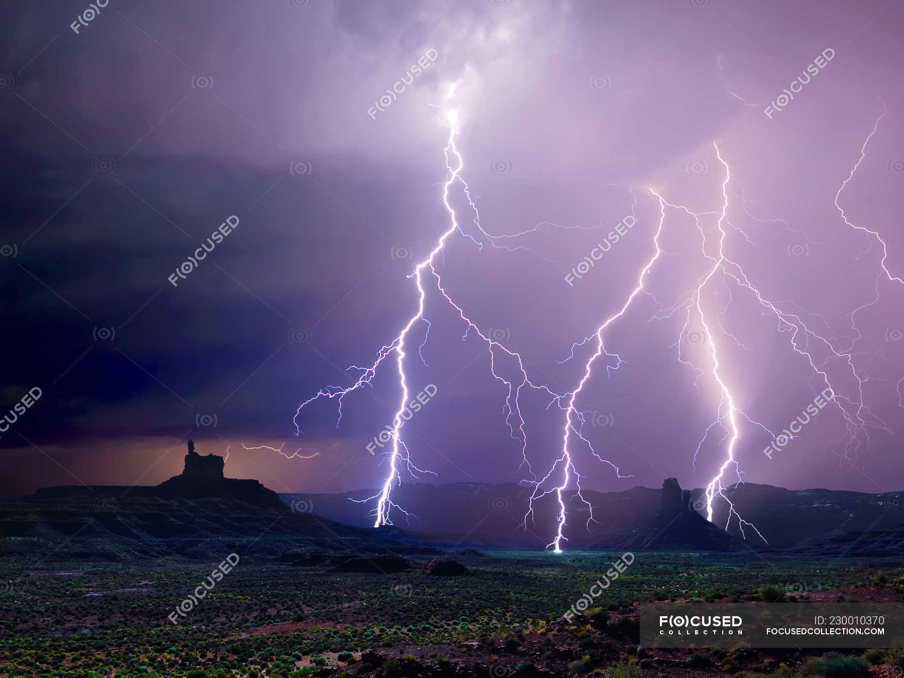 A lightning storm illuminating the north end of Utah Valley of the Gods, USA  — rain, clouds - Stock Photo | #230010370