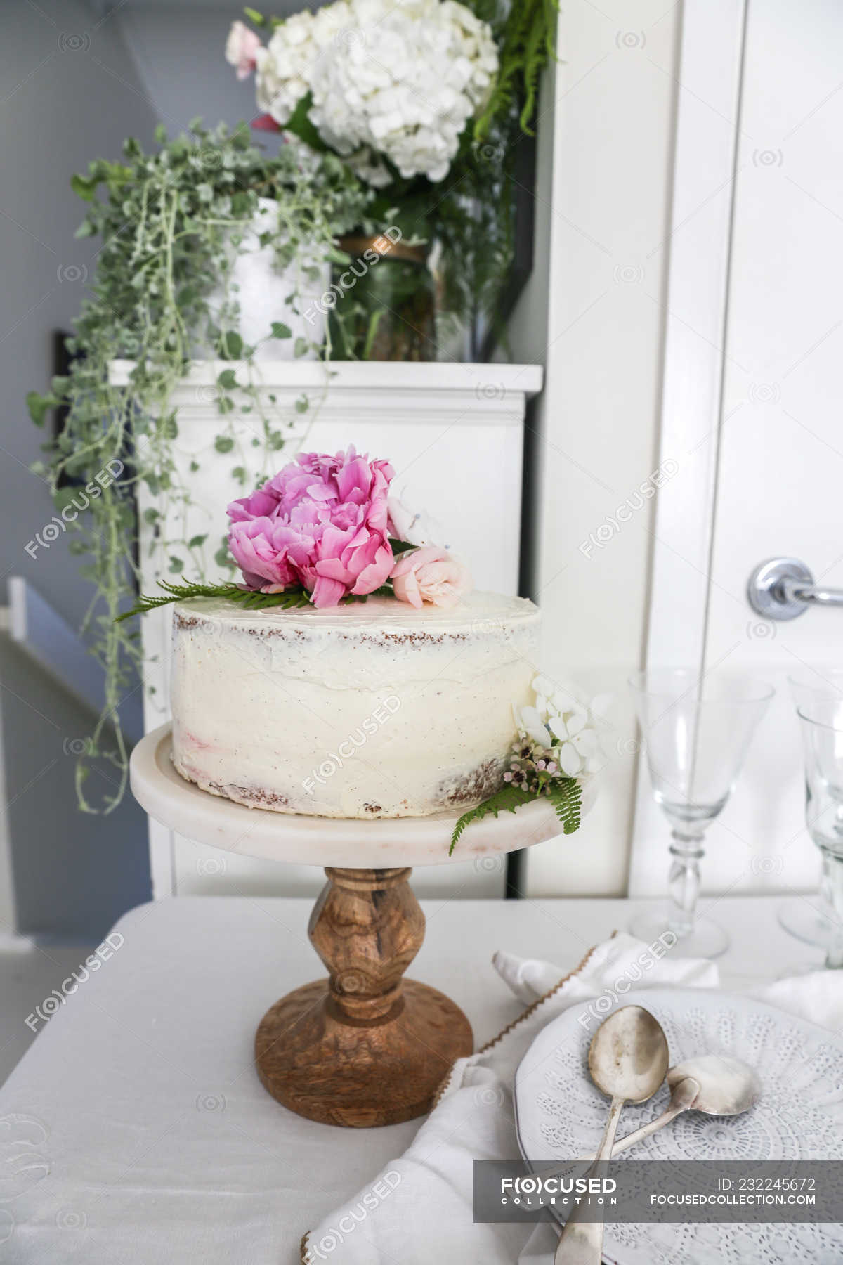 Sponge cake with buttercream icing on cake stand — dessert, Indulgence