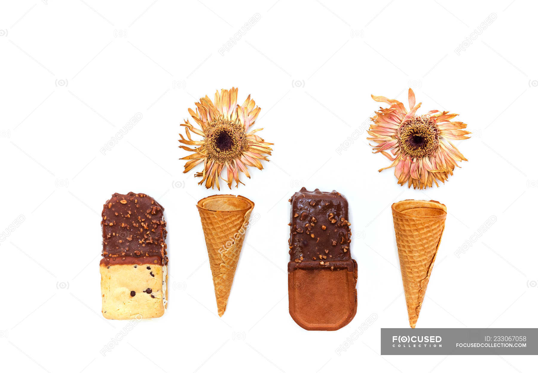 Icecream sandwiches and waffle cones on white background — conceptual