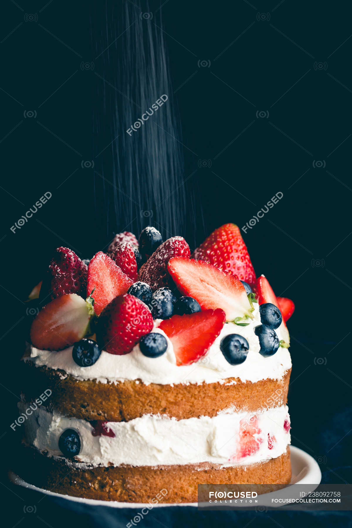 Sponge Cake With Strawberries Blueberries And Cream Still Life