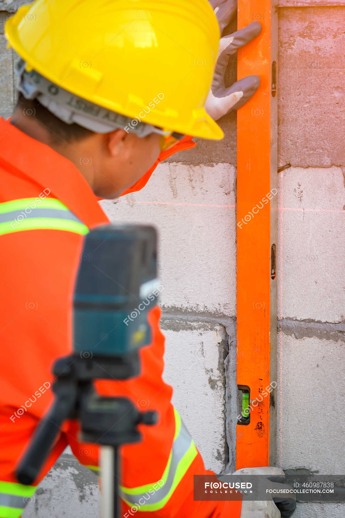 construction-worker-using-a-spirit-level-on-a-building-site-thailand