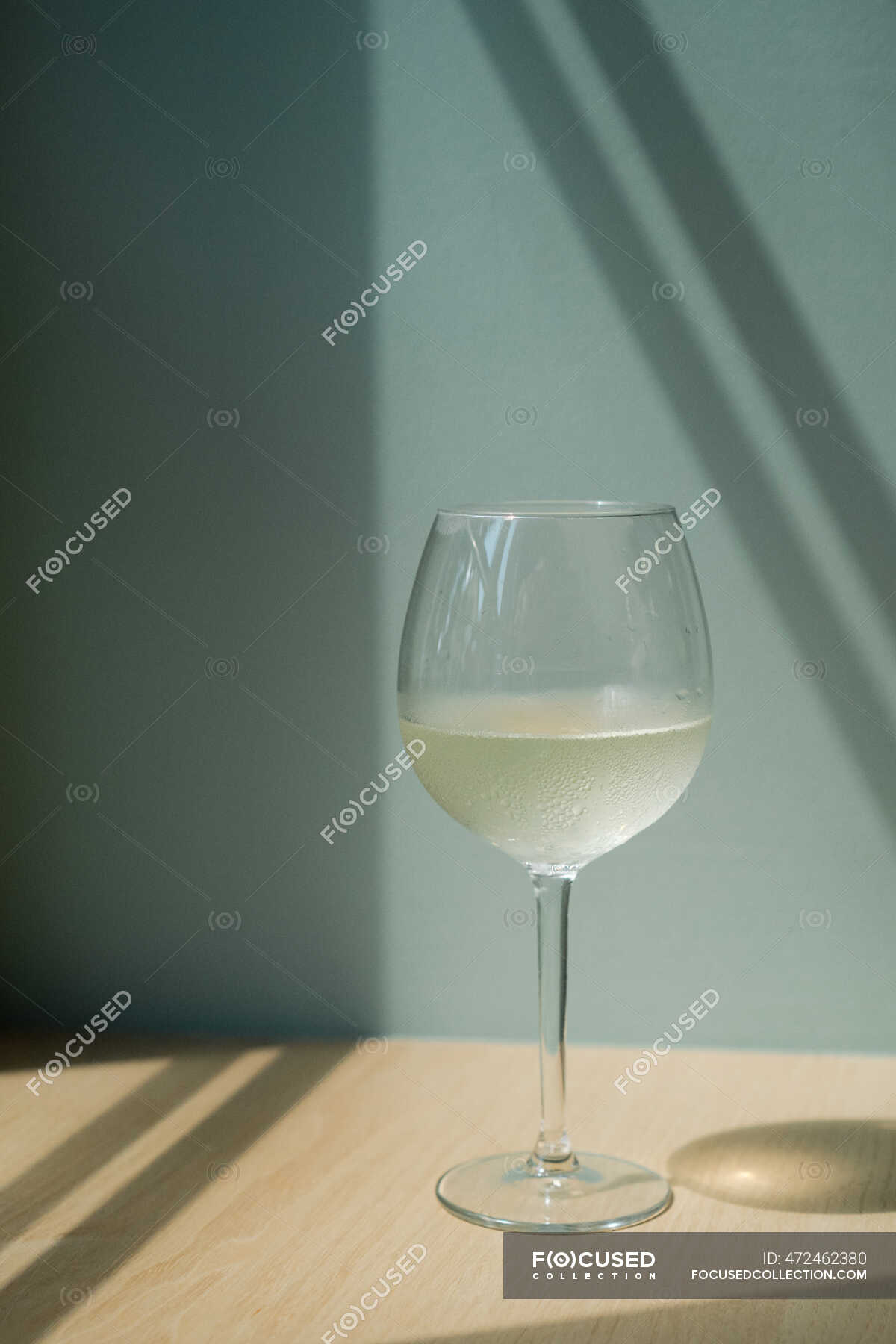 Glass of white wine on a table — day, refreshment Stock Photo