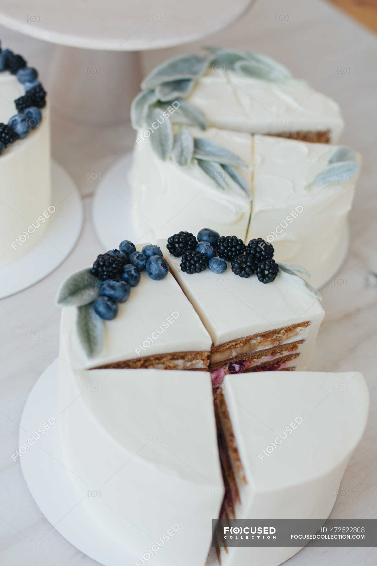 Slices of Cake with buttercream icing and fruit — carrot cake