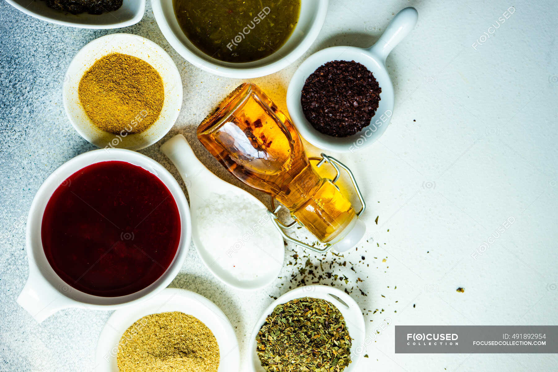 Overhead view of dried chilli, chilli paste and assorted herbs and