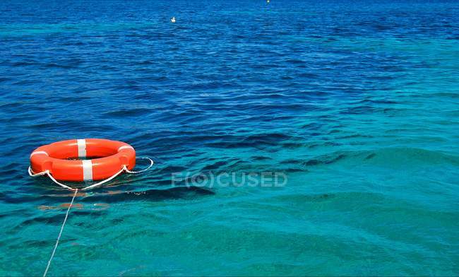 Sea with life belt on water — Stock Photo