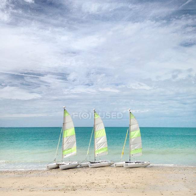 Three catamarans on beach — Stock Photo
