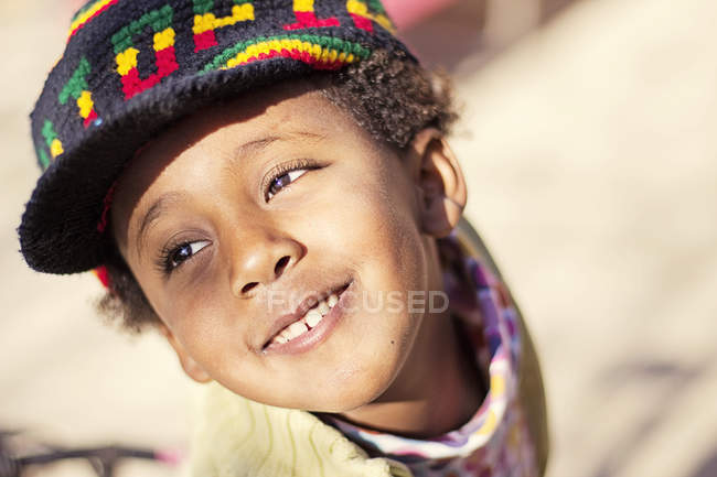 Young girl wearing colorful hat — Stock Photo